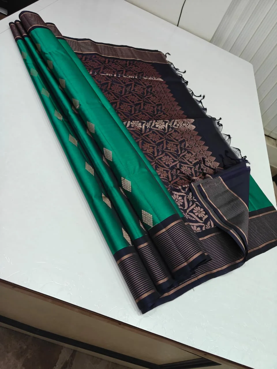 Peacock Green and Navy Blue Soft Silk with Diamond Butta and Copper Stripe Border Saree